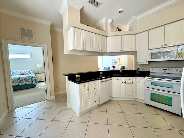 kitchen featuring white cabinets, white appliances, crown molding, and light tile patterned flooring