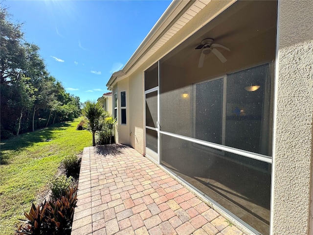 view of patio featuring ceiling fan