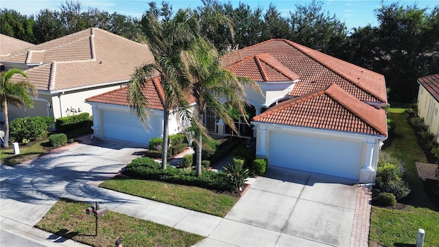 mediterranean / spanish-style house featuring a garage