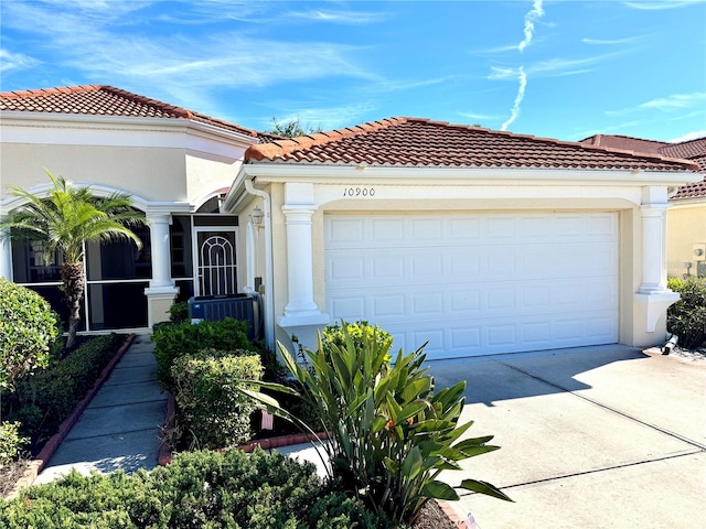 mediterranean / spanish house featuring a garage