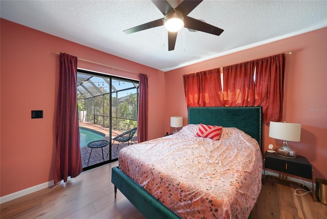 bedroom with hardwood / wood-style flooring, ceiling fan, a textured ceiling, and access to outside