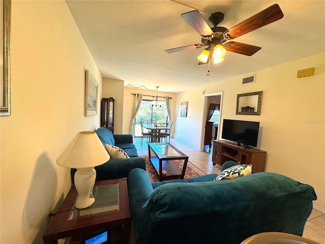 tiled living room with ceiling fan