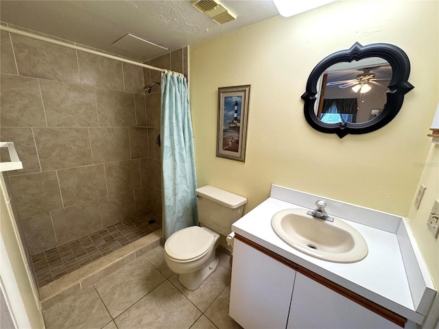 bathroom with a shower with curtain, tile patterned floors, a textured ceiling, toilet, and vanity