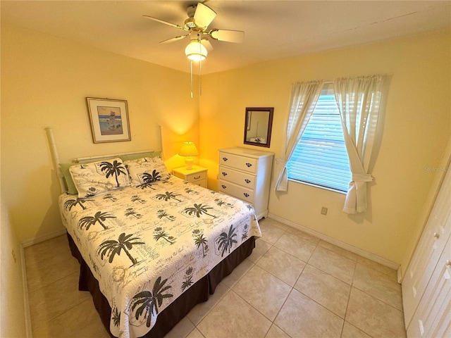 bedroom featuring ceiling fan and light tile patterned floors