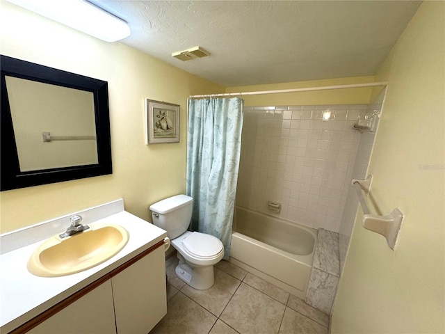 full bathroom with tile patterned floors, a textured ceiling, toilet, shower / bath combo with shower curtain, and vanity