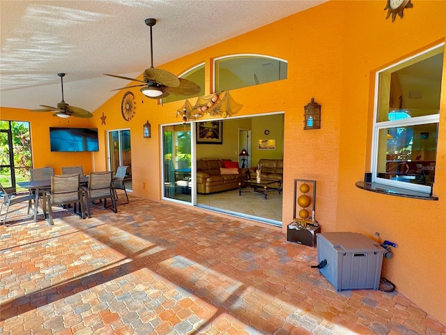 view of patio featuring ceiling fan