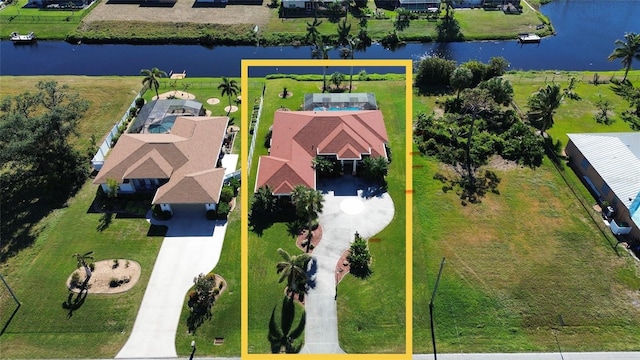 birds eye view of property with a water view