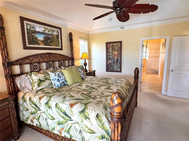 carpeted bedroom featuring connected bathroom, ceiling fan, and crown molding