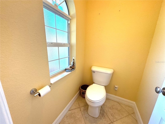 bathroom featuring tile patterned flooring and toilet