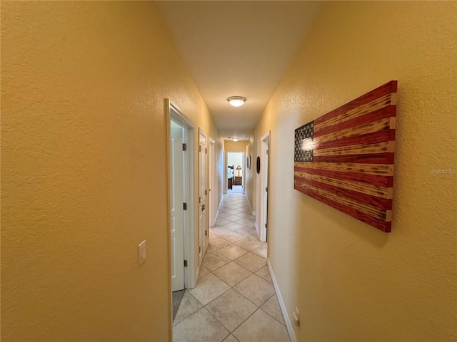 hallway with light tile patterned flooring