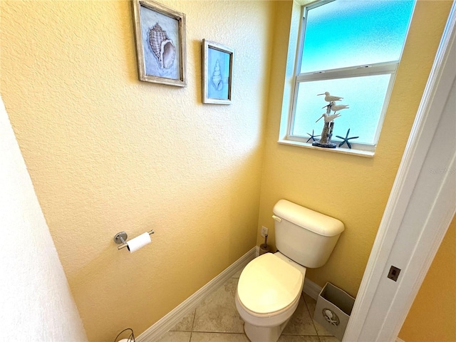 bathroom with tile patterned flooring and toilet