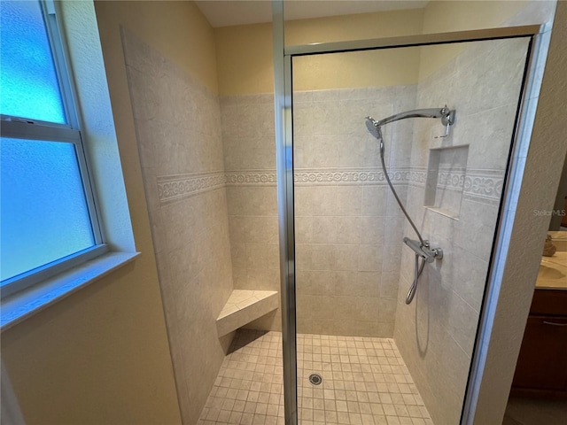 bathroom featuring vanity and an enclosed shower