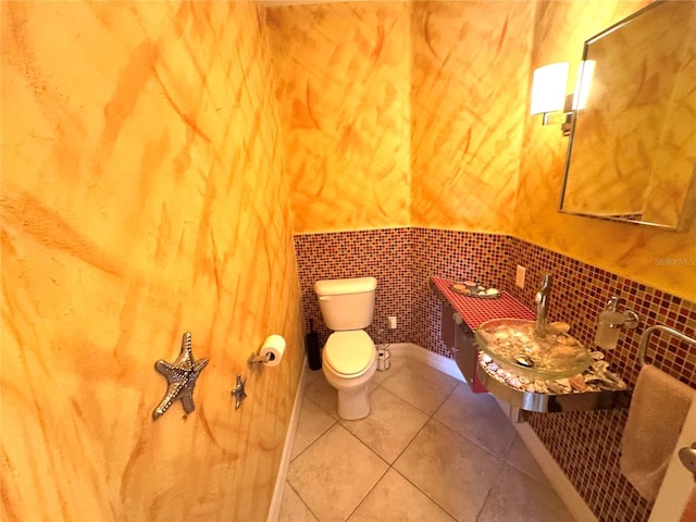 bathroom with tile patterned flooring and toilet