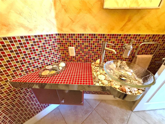 unfurnished dining area featuring tile patterned floors and tile walls