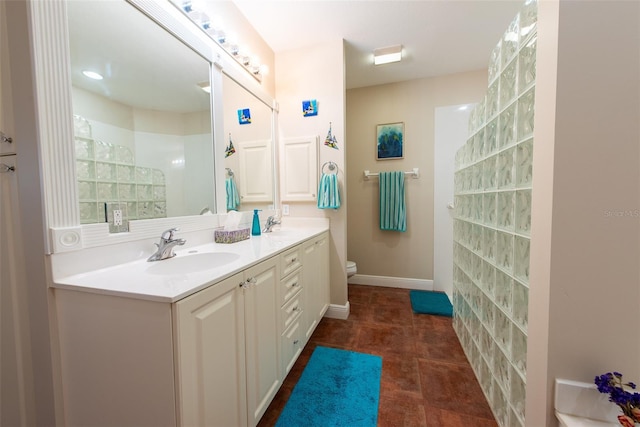 bathroom featuring tile patterned floors, vanity, and toilet