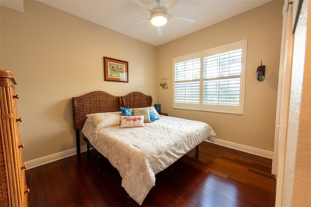 bedroom featuring ceiling fan and dark wood-type flooring