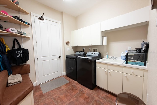 washroom with washer and dryer and sink