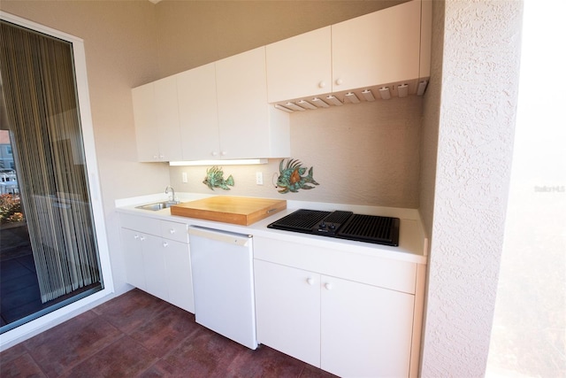 kitchen featuring white cabinetry, dishwasher, sink, and black electric cooktop