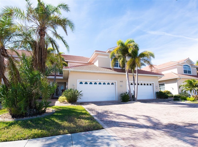 mediterranean / spanish-style house featuring a garage