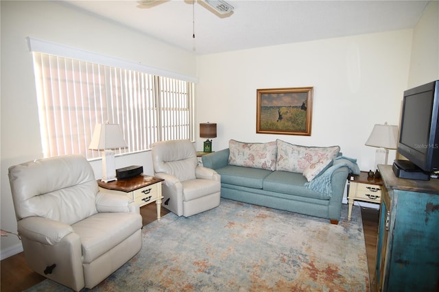 living room featuring ceiling fan and light hardwood / wood-style floors