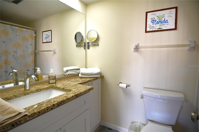 bathroom with vanity and toilet