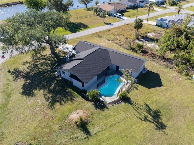 birds eye view of property featuring a water view