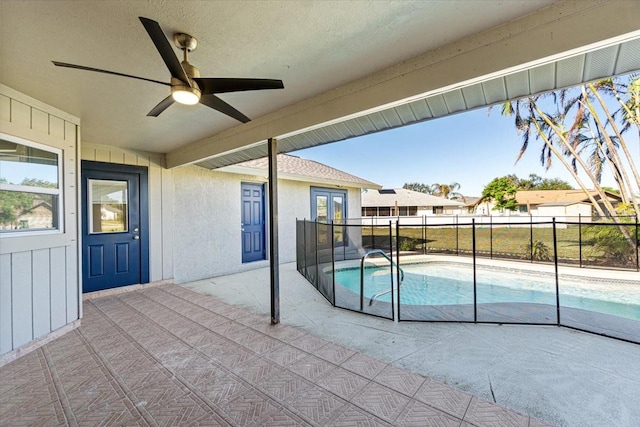 view of pool with ceiling fan and a patio area