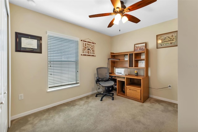 office with ceiling fan and light carpet