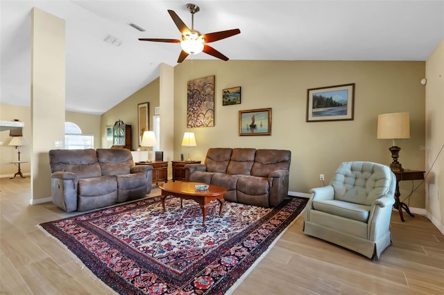 living room featuring vaulted ceiling and ceiling fan