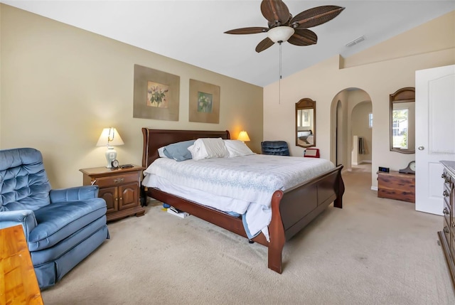 bedroom with light colored carpet, ceiling fan, and lofted ceiling