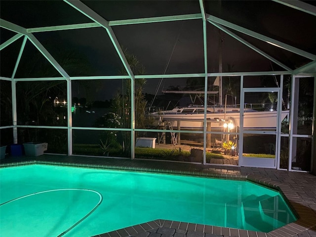 view of pool at night