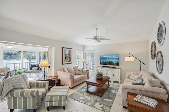 tiled living room with ceiling fan