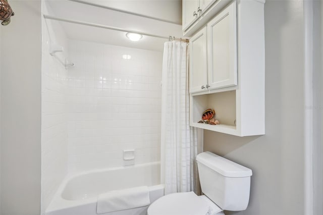 bathroom with toilet and shower / tub combo with curtain