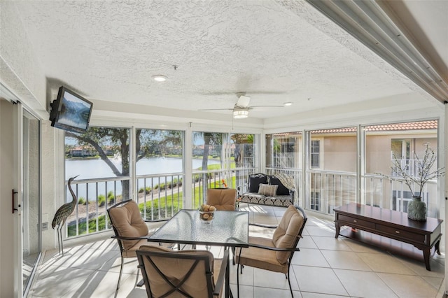 sunroom with ceiling fan and a healthy amount of sunlight