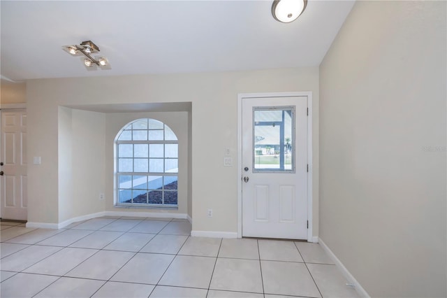 tiled entrance foyer with a wealth of natural light