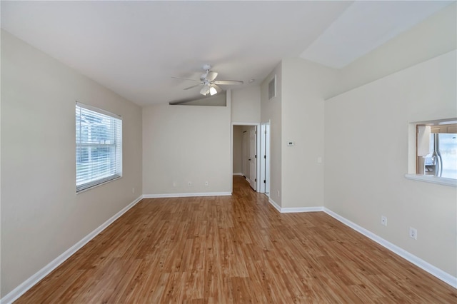 spare room featuring ceiling fan and light hardwood / wood-style floors