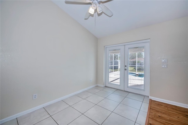 interior space featuring ceiling fan, vaulted ceiling, light tile patterned floors, and french doors