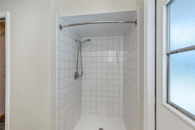 bathroom with a tile shower