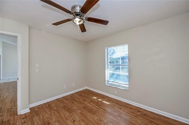 unfurnished room with hardwood / wood-style floors and ceiling fan