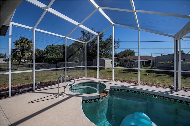 view of swimming pool with a lawn, an in ground hot tub, and a lanai