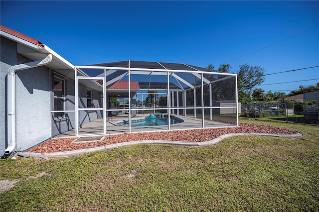 view of yard with a patio, a fenced in pool, and a lanai