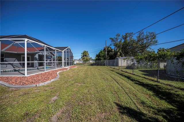 view of yard featuring glass enclosure