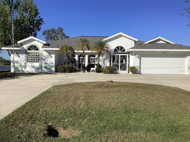 25200 Derringer Rd, Punta Gorda, FL 33983 - ranch-style house featuring concrete driveway, a garage, and stucco siding