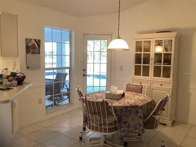 dining area featuring light tile patterned flooring