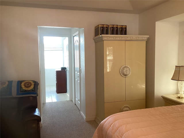 bedroom featuring light colored carpet