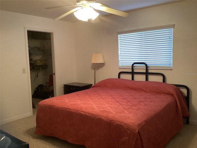 bedroom featuring ceiling fan, a closet, and light colored carpet