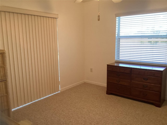 unfurnished bedroom with light colored carpet