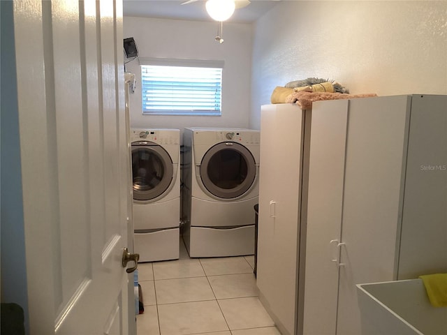 25200 Derringer Rd, Punta Gorda, FL 33983 - washroom featuring washing machine and dryer, light tile patterned floors, and ceiling fan