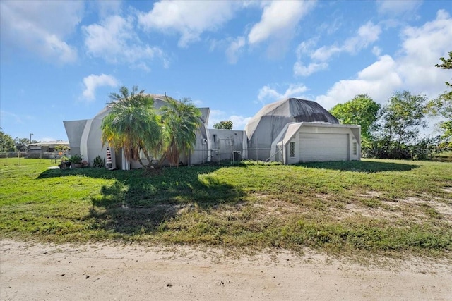 view of side of home with a garage