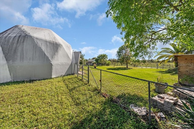 view of yard with a rural view